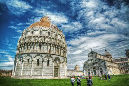 Piazza dei Miracoli under a cloudy sky in Pisa, Italyの写真素材