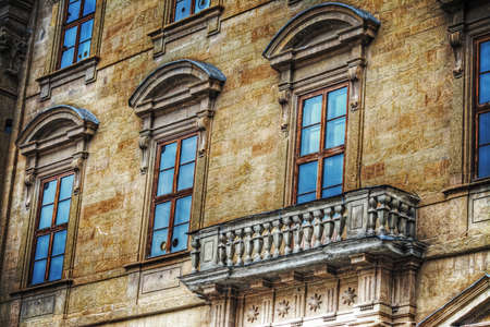 typical Tuscan balcony in a yellow building, Italyの写真素材