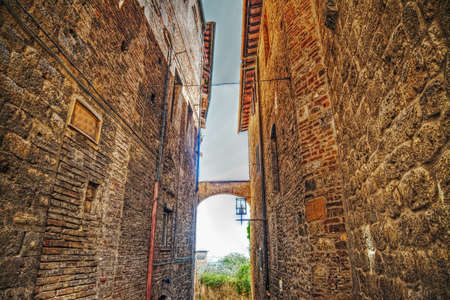 narrow backstreet in San Gimignano, Italyの写真素材