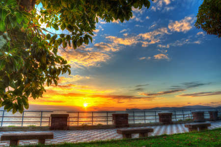 colorful sunset in Alghero seafront, Italyの写真素材