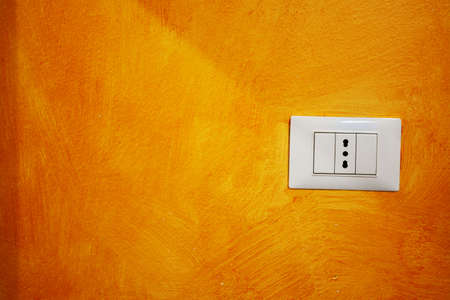 white socket in an orange wallの写真素材