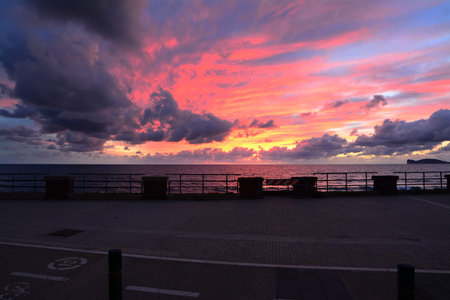 colorful sunset in Alghero seafront, Italy