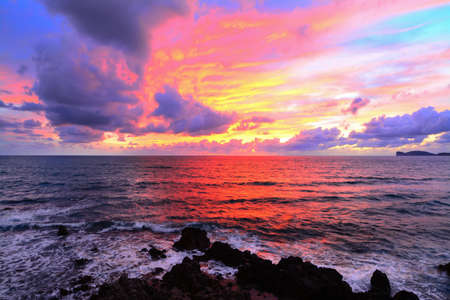 pink sky with clouds over Alghero coast, Italyの写真素材
