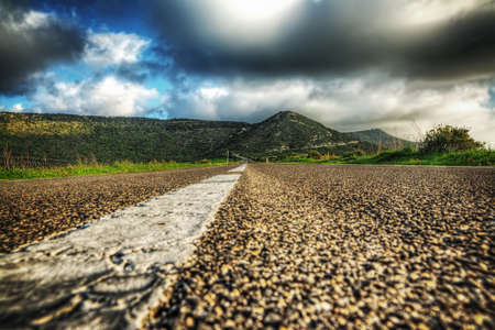 country road under a grey sky in hdr tone mapping effectの写真素材