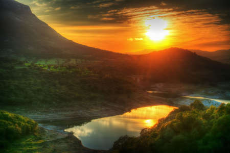 colorful sunset in Monteleone lake, Sardiniaの写真素材