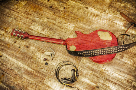 electric guitar and headphones in vintage tone effect