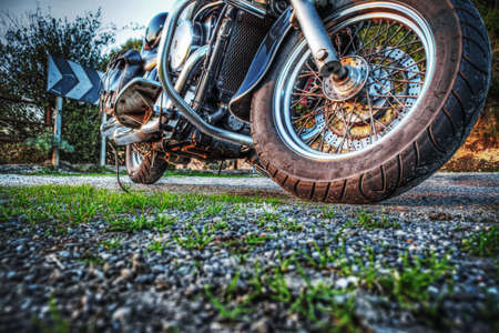 close up of a classic motorcycle seen from the ground in hdr tone mapping effectの写真素材