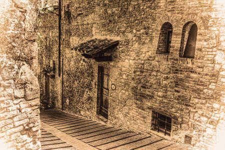 narrow backstreet in San Gimignano in vintage tone, Italyの写真素材