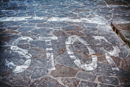 stop sign on a paved street in hdrの写真素材