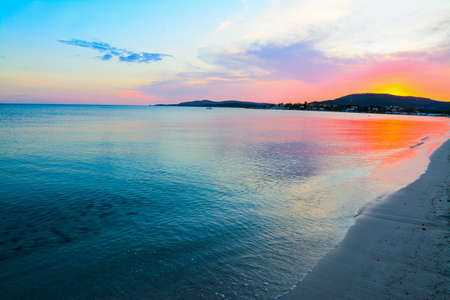 colorful sunset in Maria Pia beach, Sardiniaの写真素材