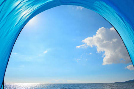 blue tent by the shore in Sardinia, Italyの写真素材