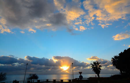 clouds over Alghero coast at sunset, Italyの写真素材