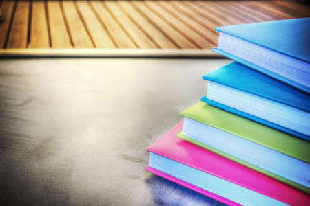 close up of colorful diaries on a blackboardの写真素材