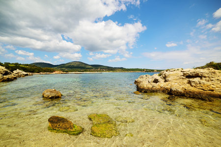 rocks and crystal clear water in Alghero, Italy