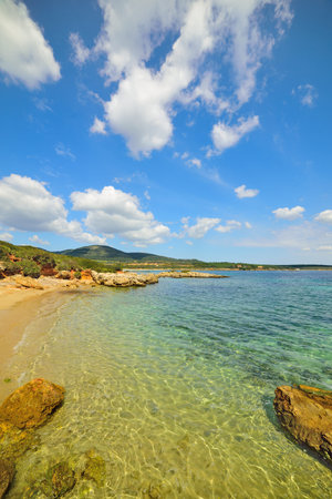 small cove under a blue sky in Sardinia, Italy