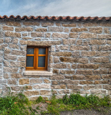 door and window in a rustic wall in Sardinia, Italy