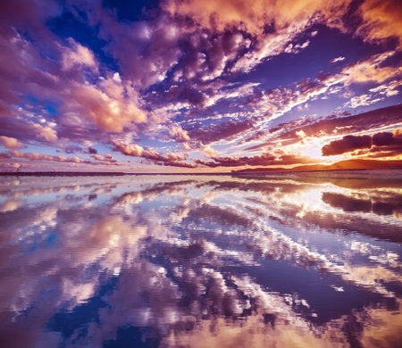 clouds reflected in the water at sunset, Sardinia
