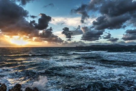 rough sea at sunset in Sardinia, Italyの写真素材