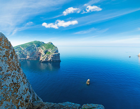 beautiful rocks in Capo Caccia bay with Foradada island on the background