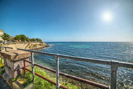 metal fence in Alghero seafront, Italyの写真素材