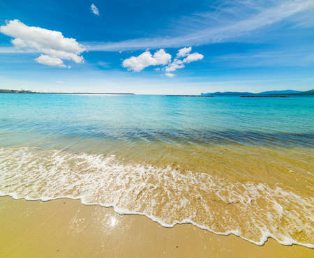 blue water in Alghero shoreline, Italyの写真素材