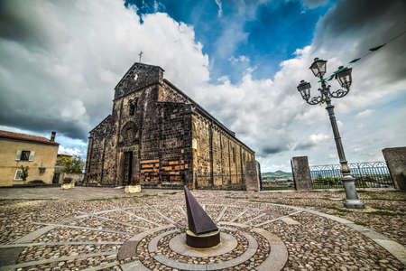metal sundial in Santa Maria del Regno square in Ardara, Sardiniaの写真素材