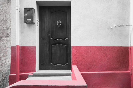 selective desaturation of a red wall in Sardiniaの写真素材