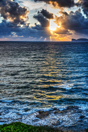 dramatic sky over Capo Caccia, Sardiniaの写真素材