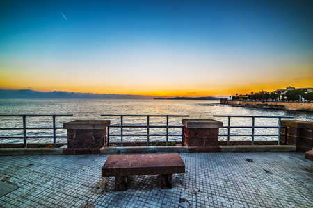 bench in Alghero seafront, Sardiniaの写真素材