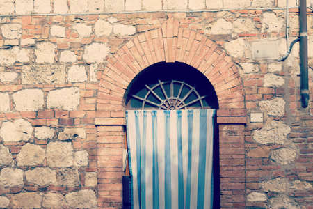 close up of a curtain on an old door in Tuscany, Italyの写真素材