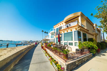 Beautiful houses by the sea in Balboa Island, Californiaの写真素材