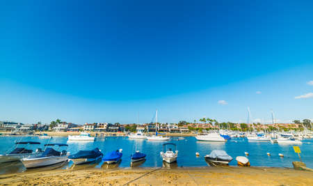 Boats by the shore in Balboa island, Californiaの写真素材