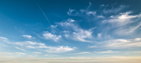 blue sky with white clouds at sunset
