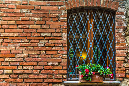 flowers on a window sill in Tuscany, Italyの写真素材
