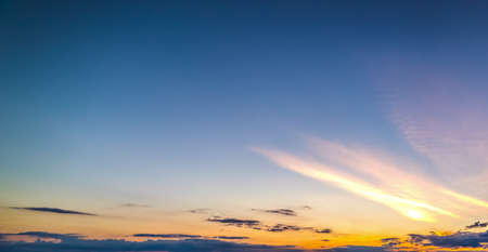 yellow and blue sky at sunsetの写真素材