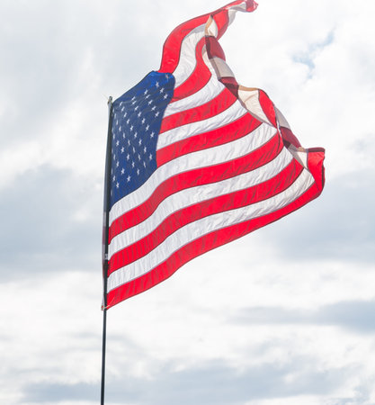 USA flag waving in the wind in Californiaの写真素材