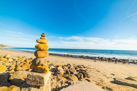 Stone pile in Malibu shoreline, Californiaの写真素材