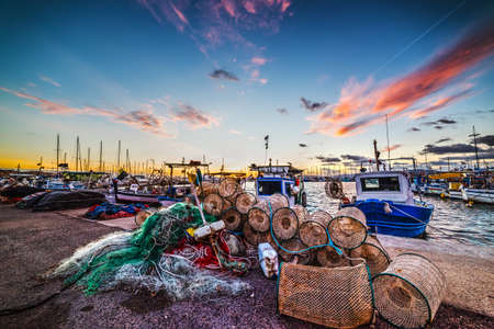Alghero harbor at sunset, Sardiniaの写真素材