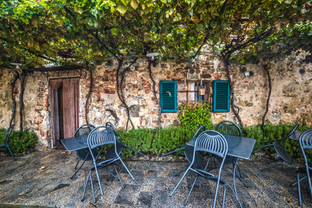 table and chairs in Monteriggioni, Italyの写真素材