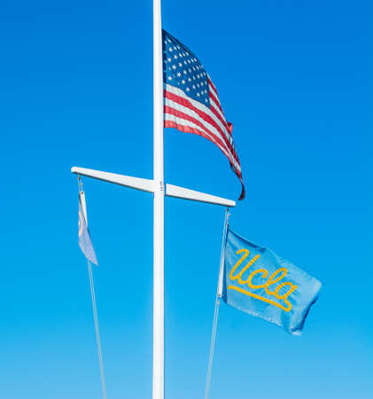 Los Angeles, California - November 02, 2016: US and UCLA flags under a clear skyのeditorial素材