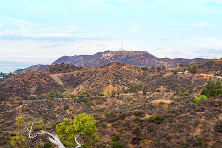 LOS ANGELES, CALIFORNIA - OCTOBER 27, 2016: Hollywood sign under a blue sky with clouds, Californiaのeditorial素材