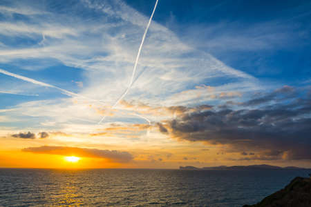 Scenic clouds at sunset in Sardinia, Italyの写真素材