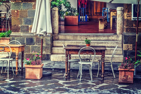 Rustic table and chairs in Tuscany, Italyの写真素材