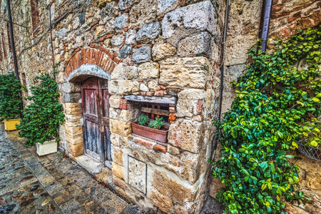 old wooden door in Monteriggioni, Italyの写真素材