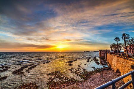 Cloudy sky over Alghero at dusk, Sardiniaの写真素材