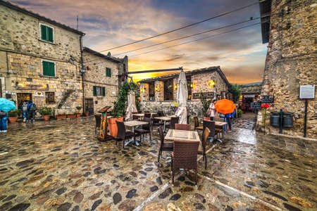 Monteriggioni, Italy - October 13, 2016: Main square at sunsetのeditorial素材