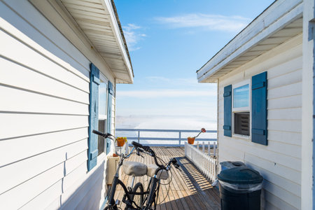 Bicycle between two beach houses in California