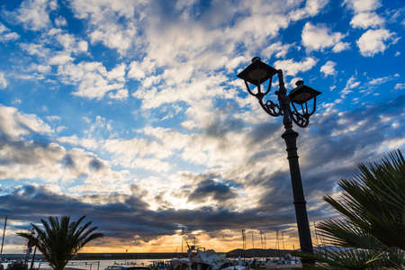 Lamppost in Alghero harbor, Sardiniaの写真素材