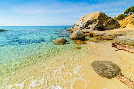 Cala Caterina shoreline under clouds, Sardiniaの写真素材