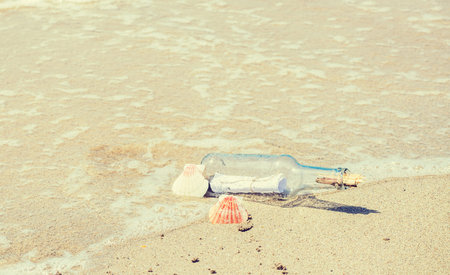 Bottle with message on the foreshore of a tropical island